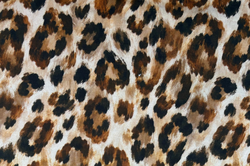 Tricot katoen stof, panter print, crème/bruin. Actie47-1