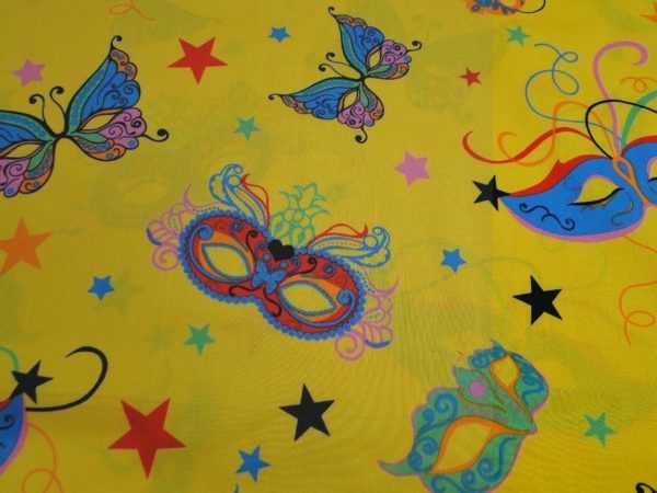 Katoen stof geel met maskers print