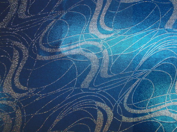 Lycra stof aqua blauw met zilver draad motief