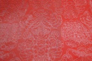 Lycra velours ornament jacquard zalm/roze neon