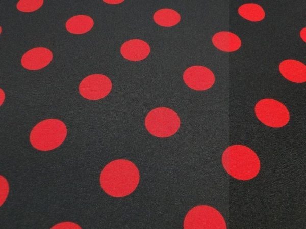Texture stof zwart met rode stip