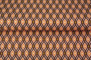 Z0874-stenzo-tricot-katoen-stof-klein-ornament-lichtroze-oranje-bruin-geel