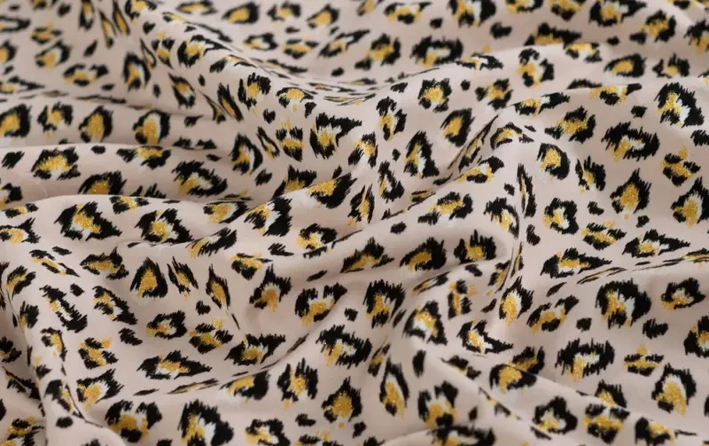 French terry stof, panter print glitter, crème/zwart/goud. A.068-5